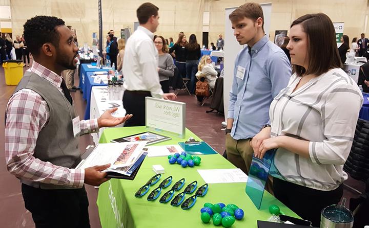 Photo of people talking at a career fair